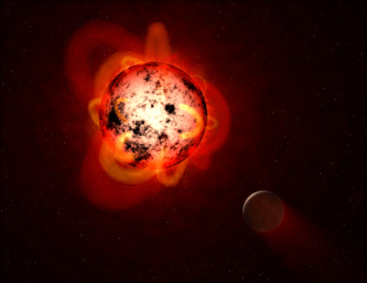 上图显示一颗被假想的行星环绕的红矮星。当它们年轻时，红矮星往往具有磁性，显示出巨大的弧形突起和大量的太阳黑子。红矮星也会爆发强烈的耀斑，随着时间的推移，可能会剥离附近行星的大气层，或者使其表面不适合生命存在。（NASA/ESA）